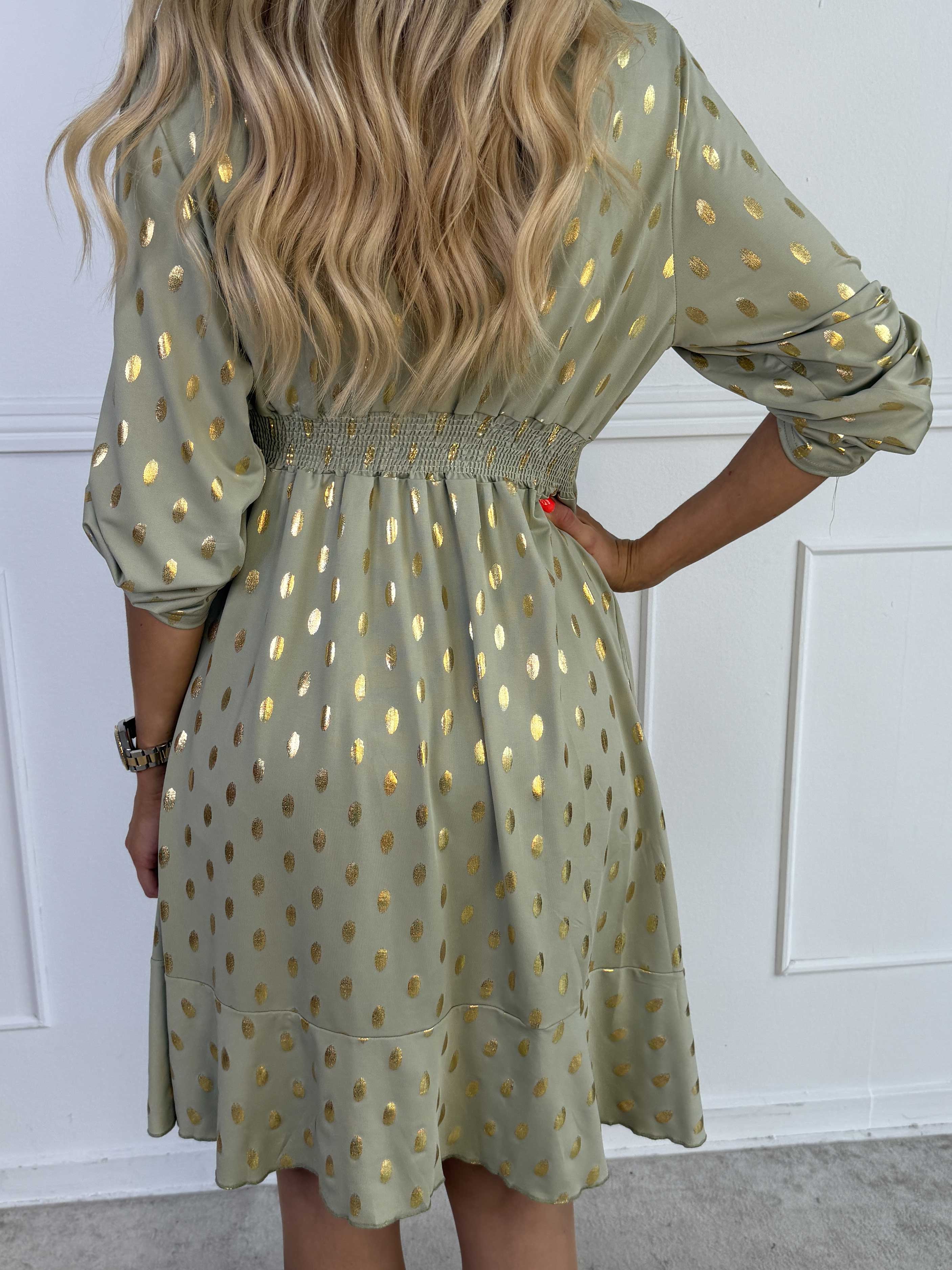 Savina Gold - Elastisk kjole i slå-om-look med guld dutter